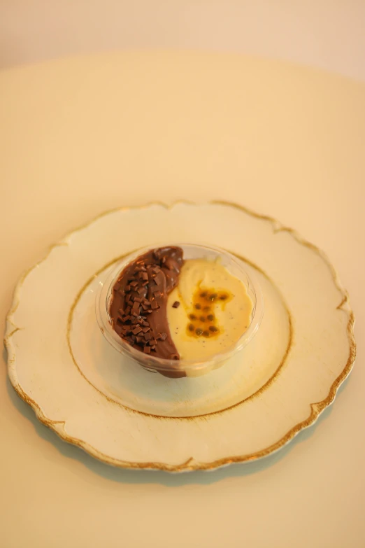 a plate has chocolate desert in it sitting on a table