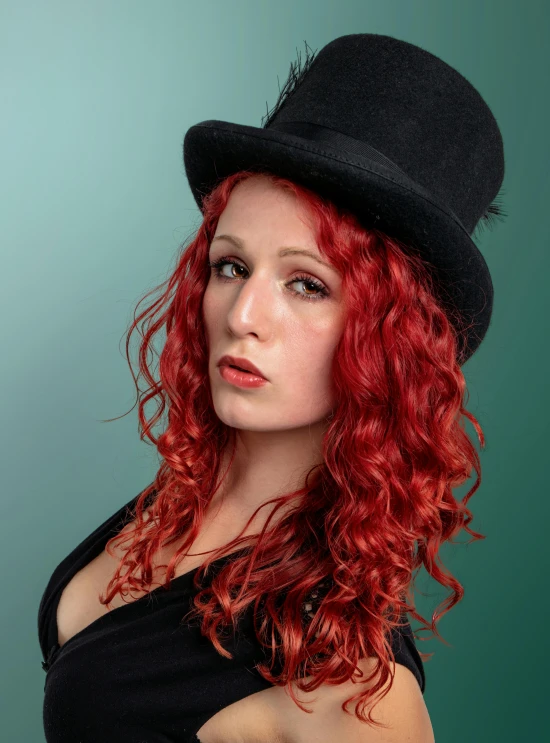 a woman with red hair wearing a hat