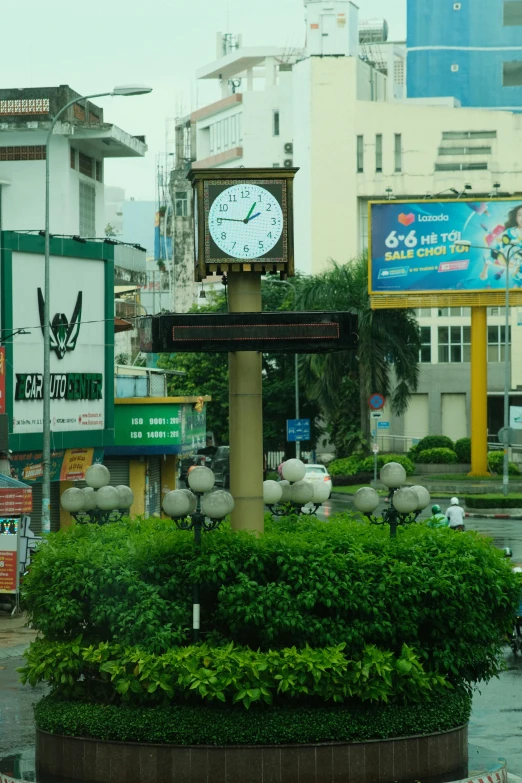 a town square with a tall clock in the middle