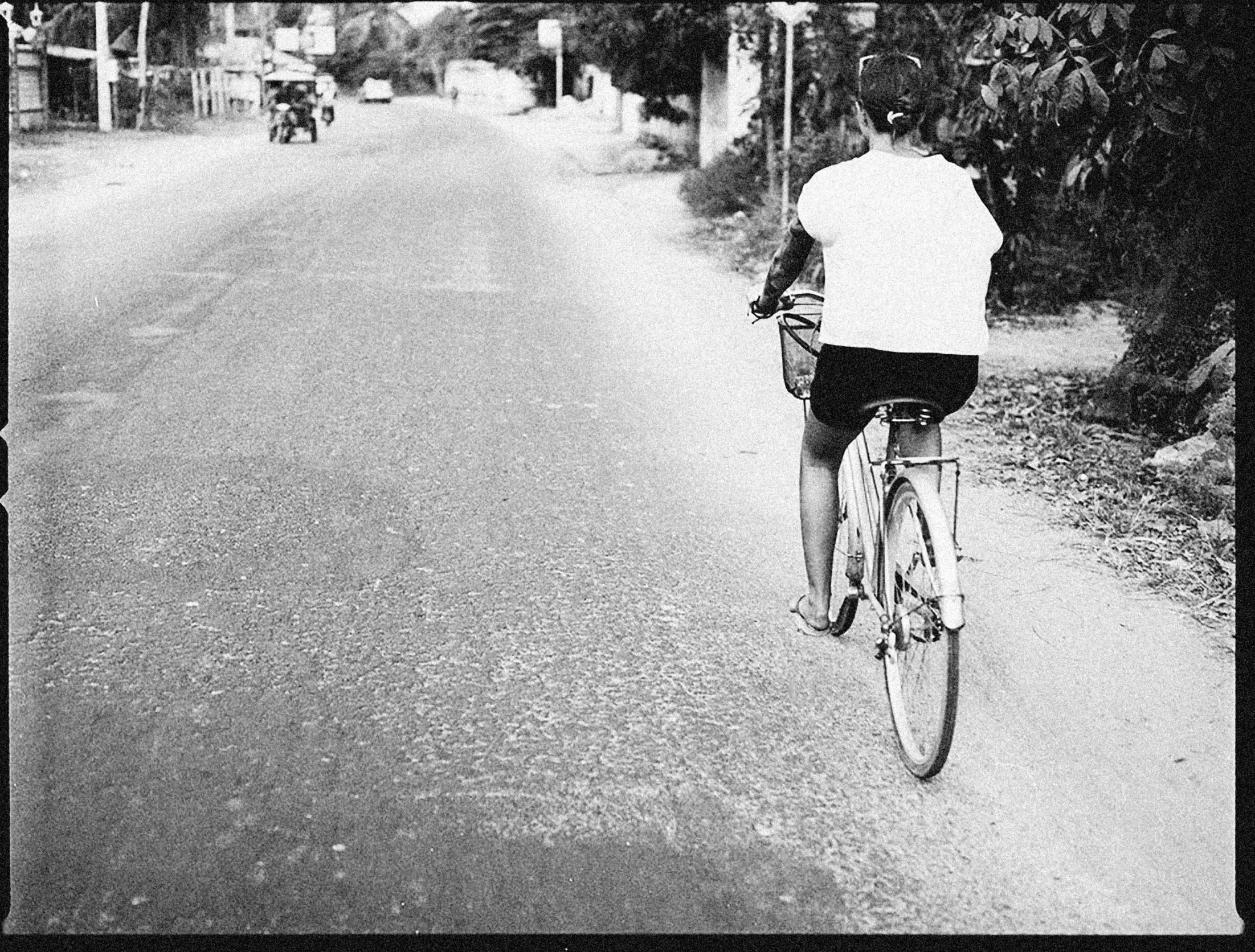 a person on a bike in the middle of the road