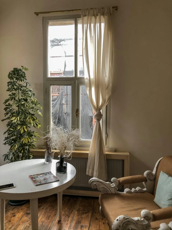 a wooden floor and table in a room