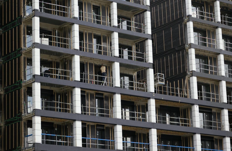 the building has multiple balconies attached to the sides