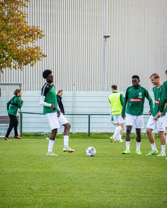 a group of soccer players on the field