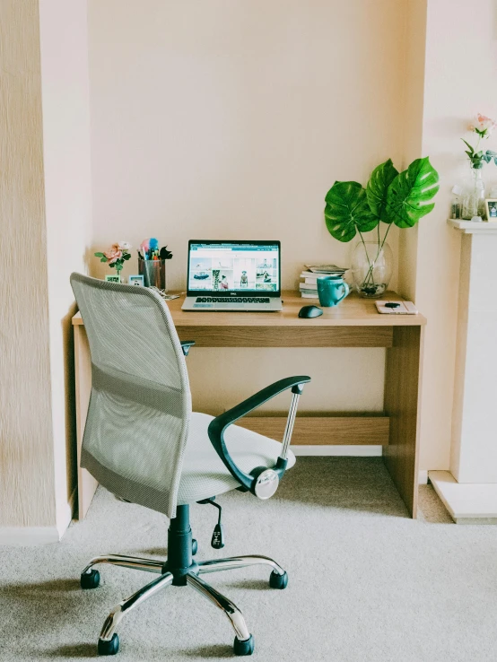 an office chair sitting in front of a desk