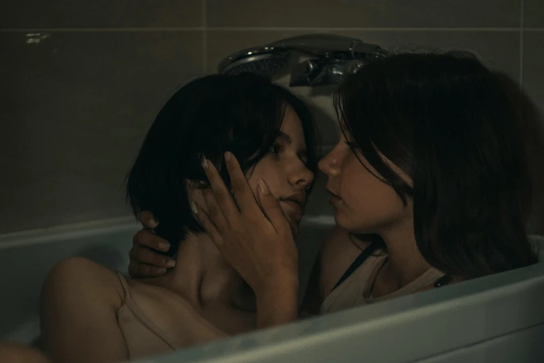 two women take a bath together in the tub