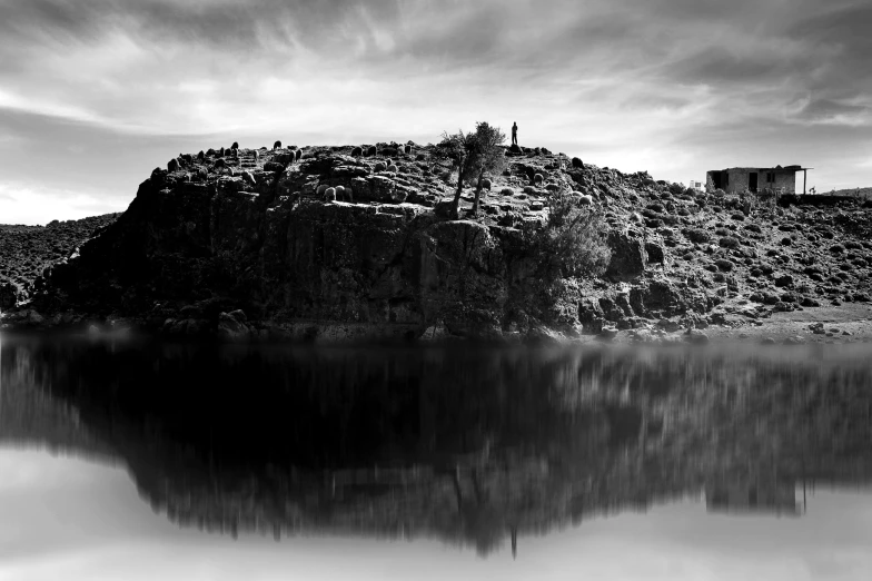 a very small hill with water in it