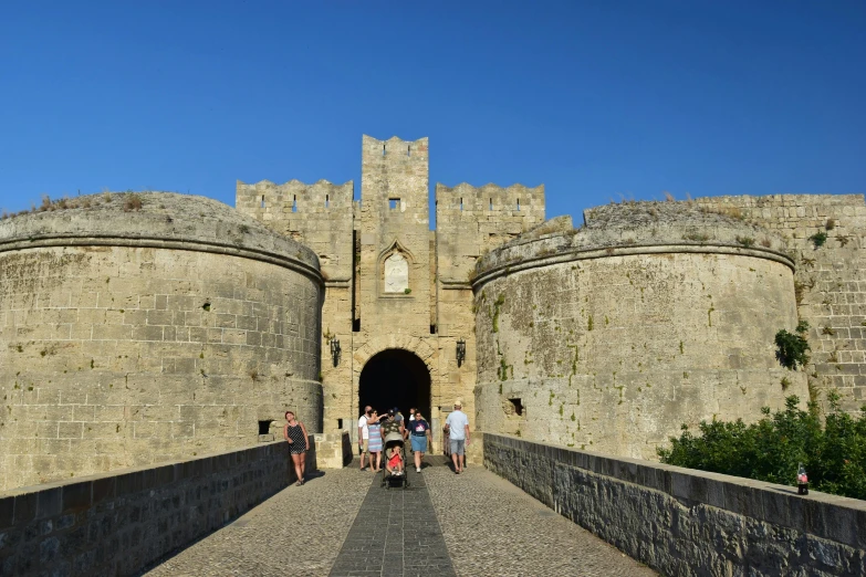 a group of people standing in front of a castle