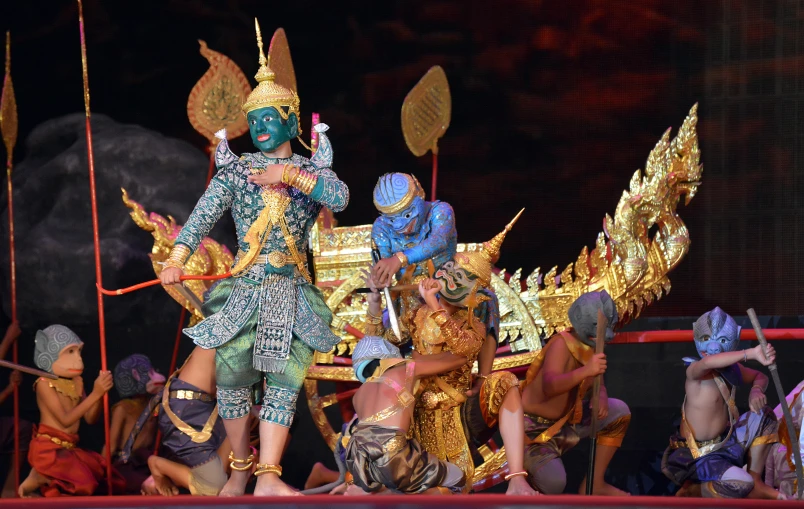 people dressed as gods perform in a show