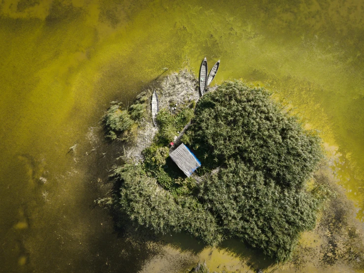 an aerial view of the bird - eye view of a house with its water surrounding it