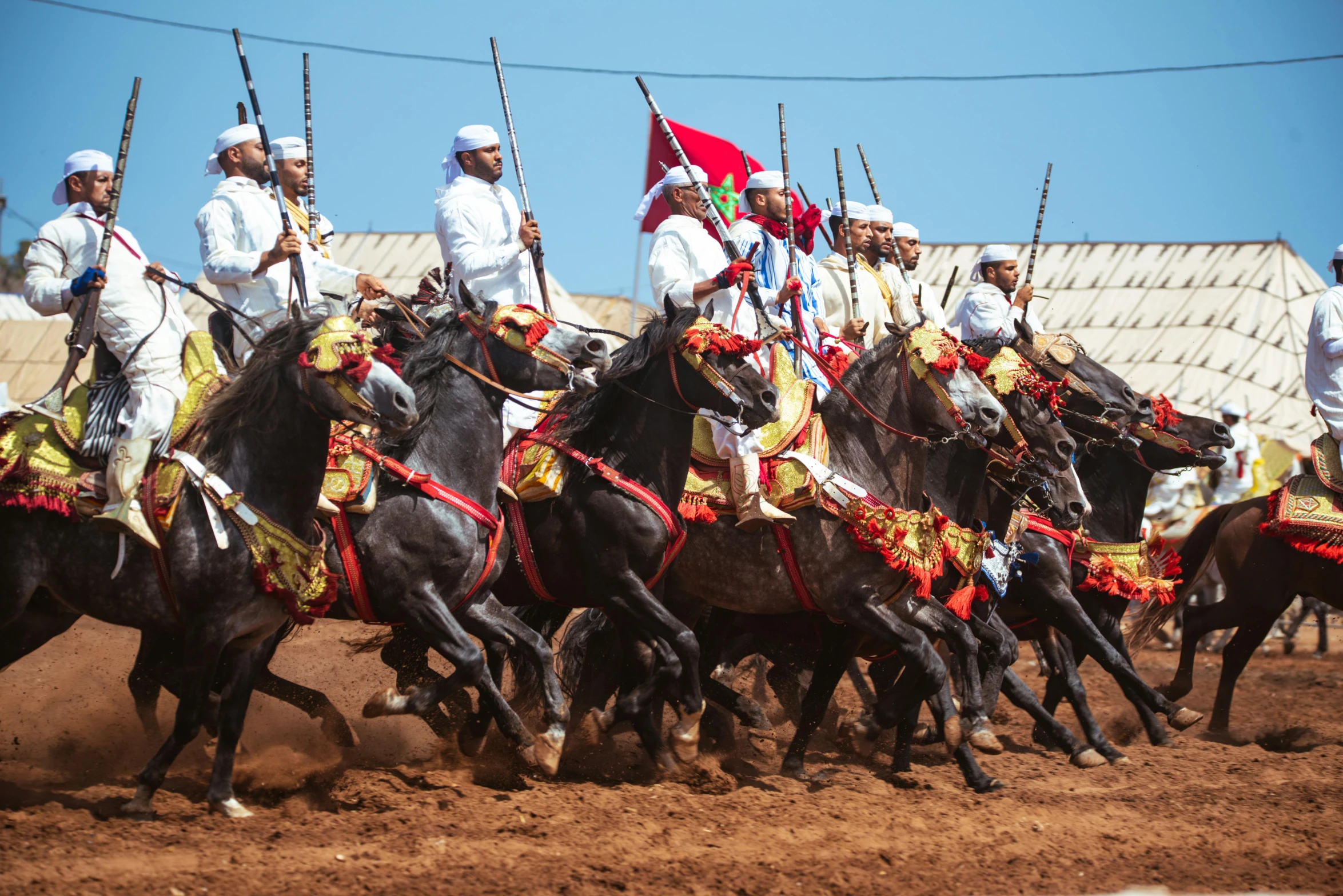 a group of men riding on the backs of horses