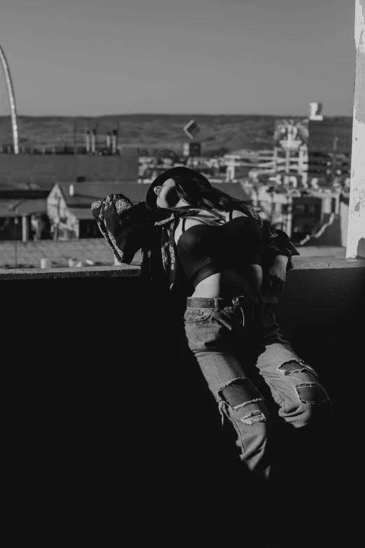 a man is sleeping on the ledge of a building