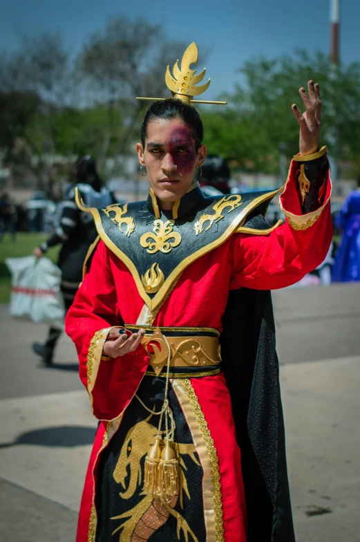 a man in a costume posing for the camera