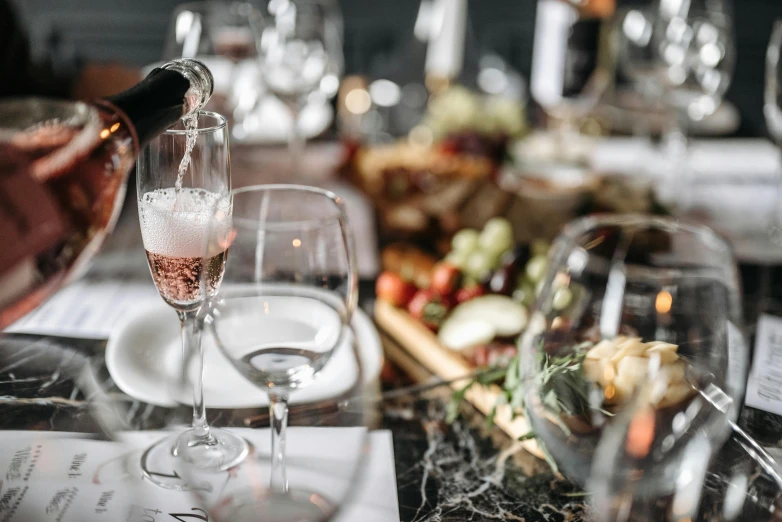 the pouring of wine at an event is on the table