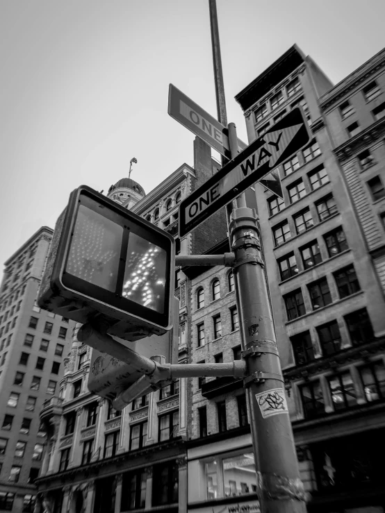 a stop light and some very large buildings