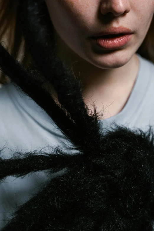 a close up of a person with long hair and bangs