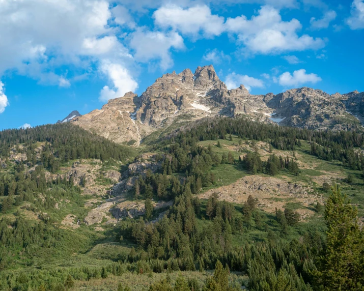 large mountains with a blue sky and clouds