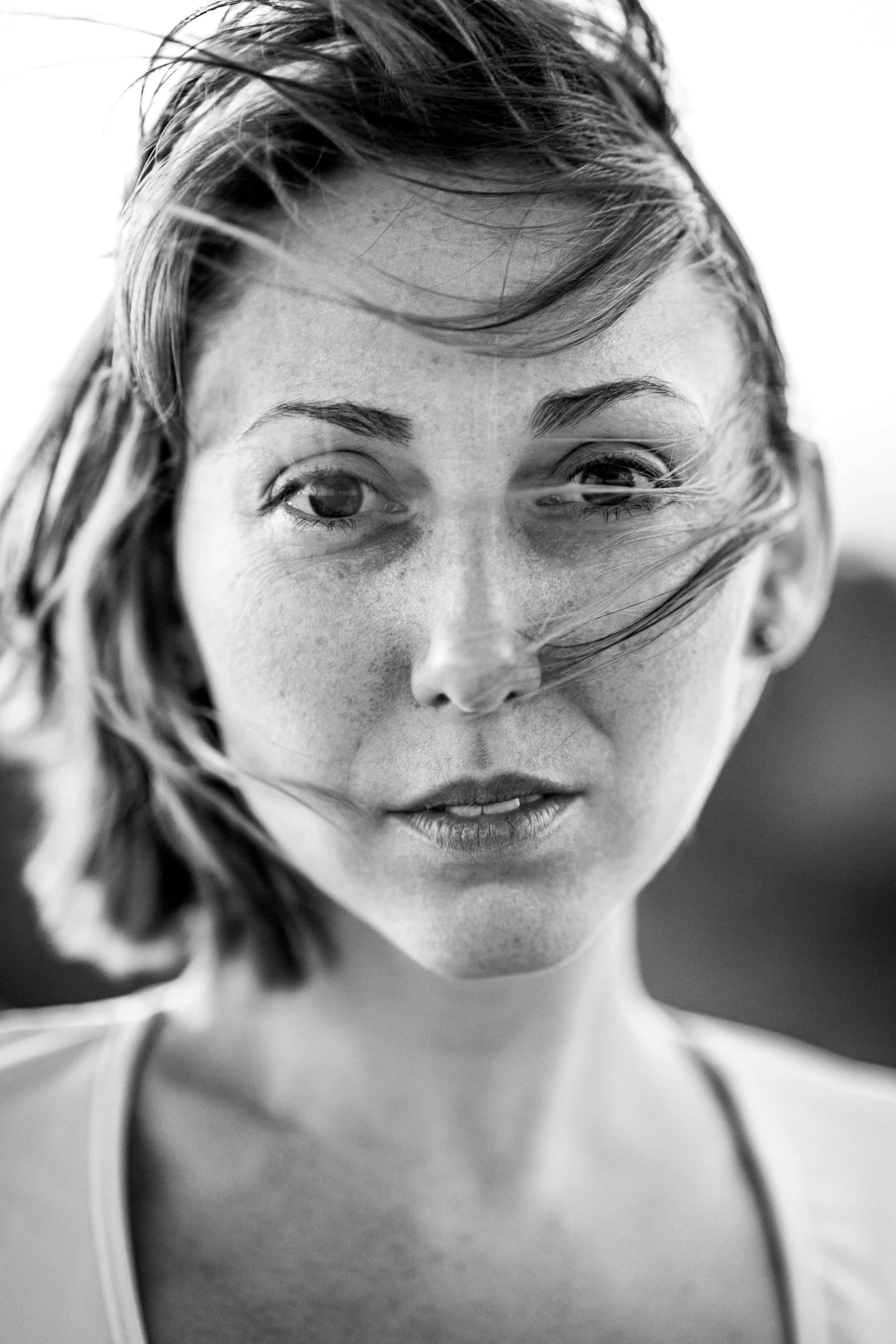 a black and white po of a woman with wet eyes