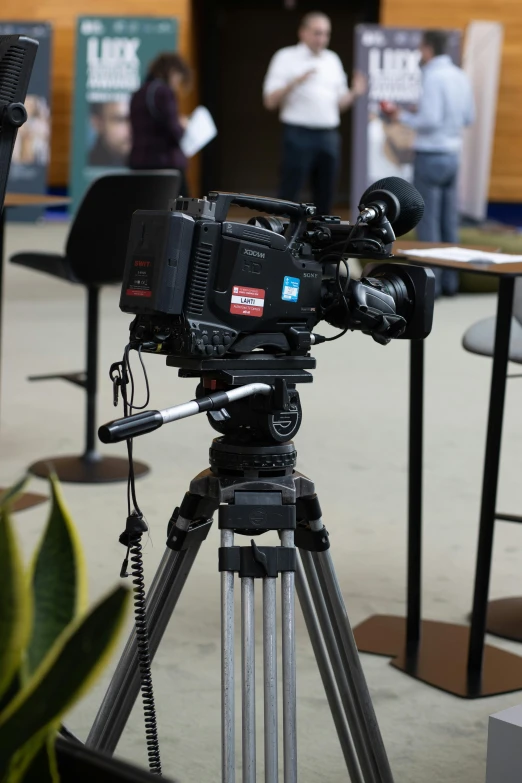 an electronic camera attached to a tripod