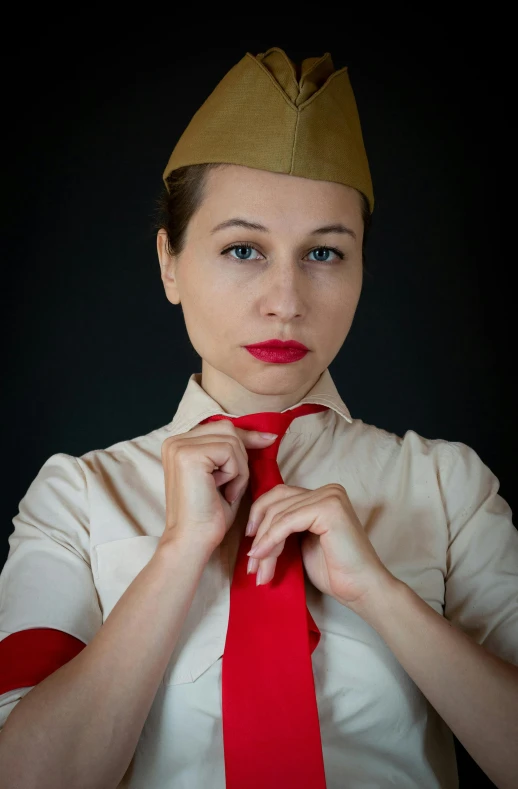 a woman wearing a white shirt and red tie