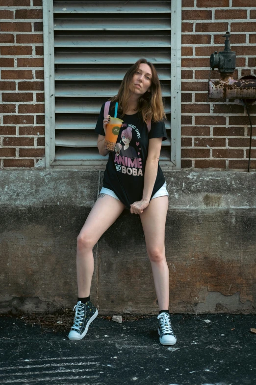 a girl posing for a po in front of a building