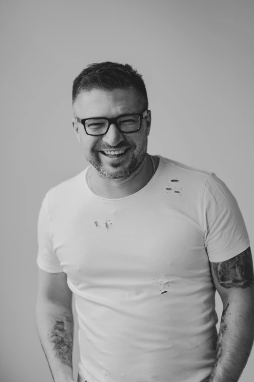 black and white portrait of a man wearing glasses