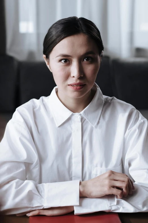 woman with a collared shirt in a room