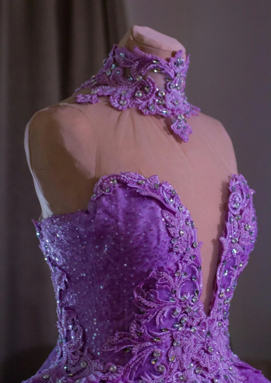 a very elaborate purple corset dress on display