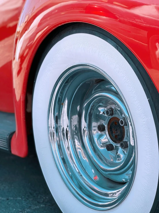 the rear end of an orange and white sports car