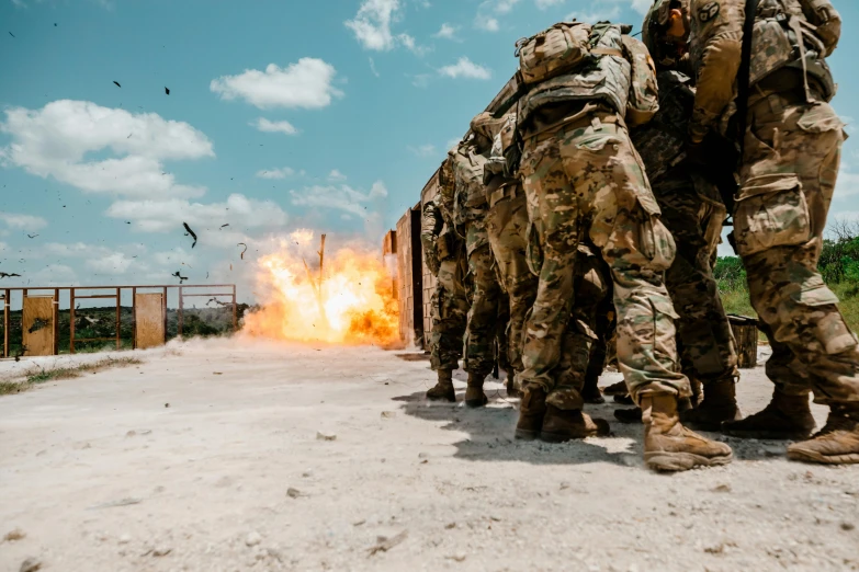 the marines fire their cannon from their camouflage uniforms