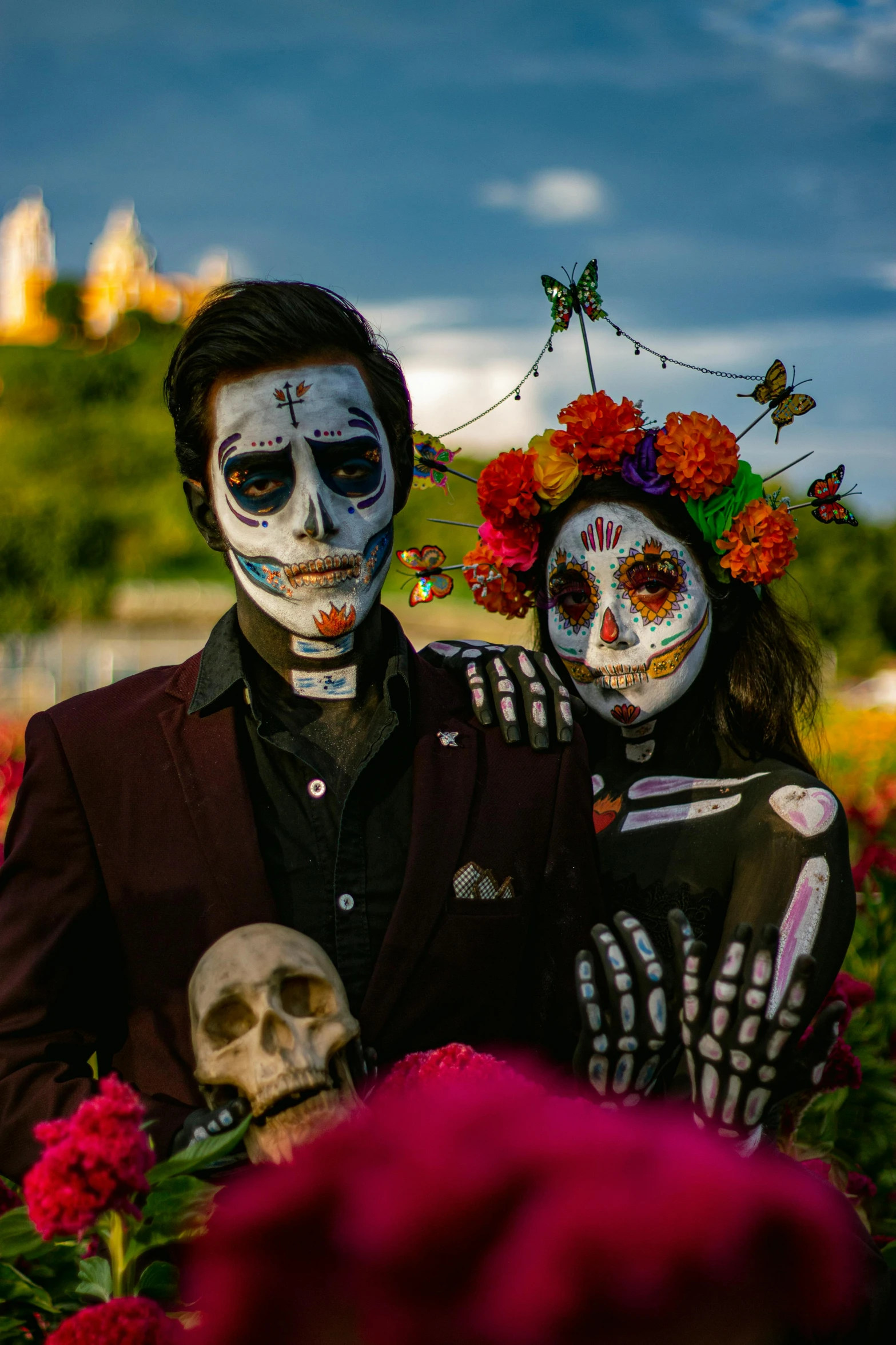 two people with skull makeup standing together