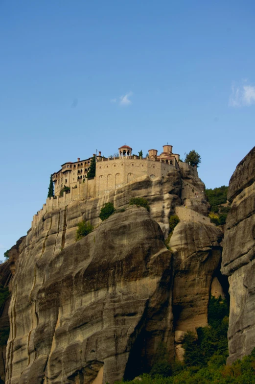 the building that is on top of a mountain