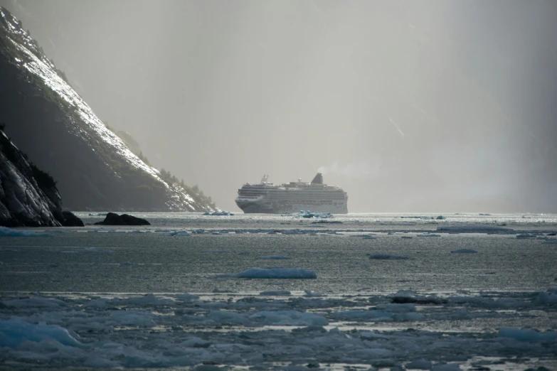 a boat floating on top of an ice covered river