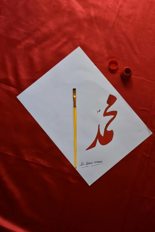 an oriental calligraphy written in a red and white paper