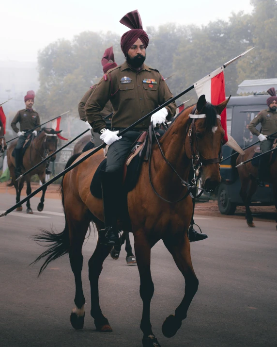 soldiers on horseback are seen during a ceremony