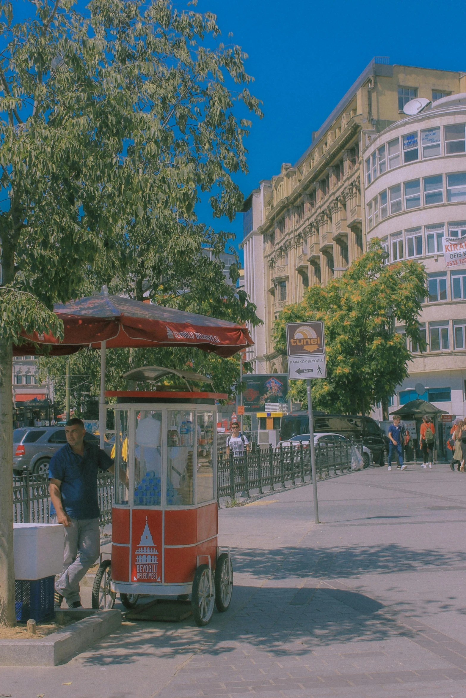 a man sitting on top of a small cart