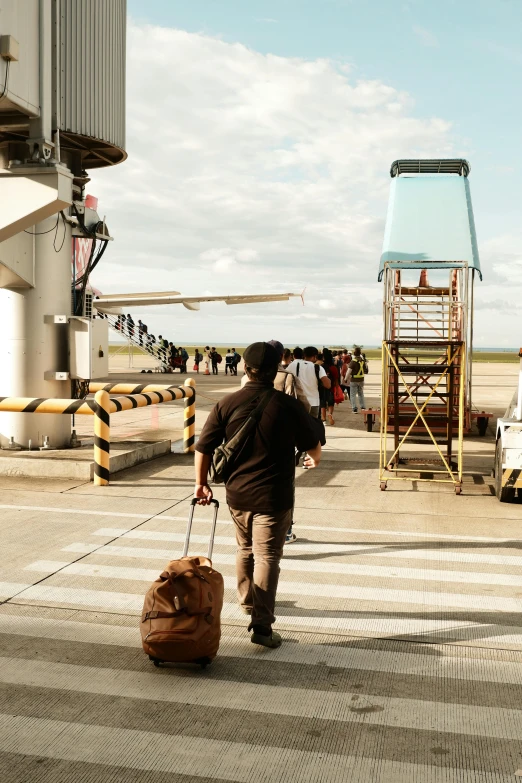 the man is carrying the bag behind him and walking away