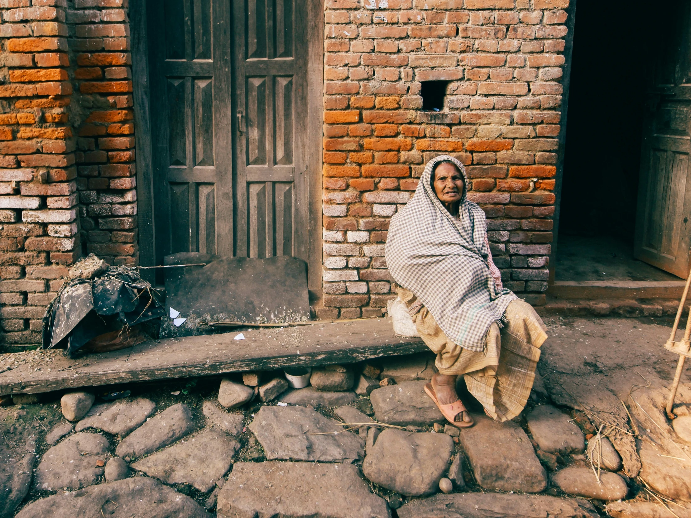 the lady is standing in front of a building