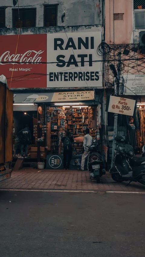 a street in front of a restaurant and store