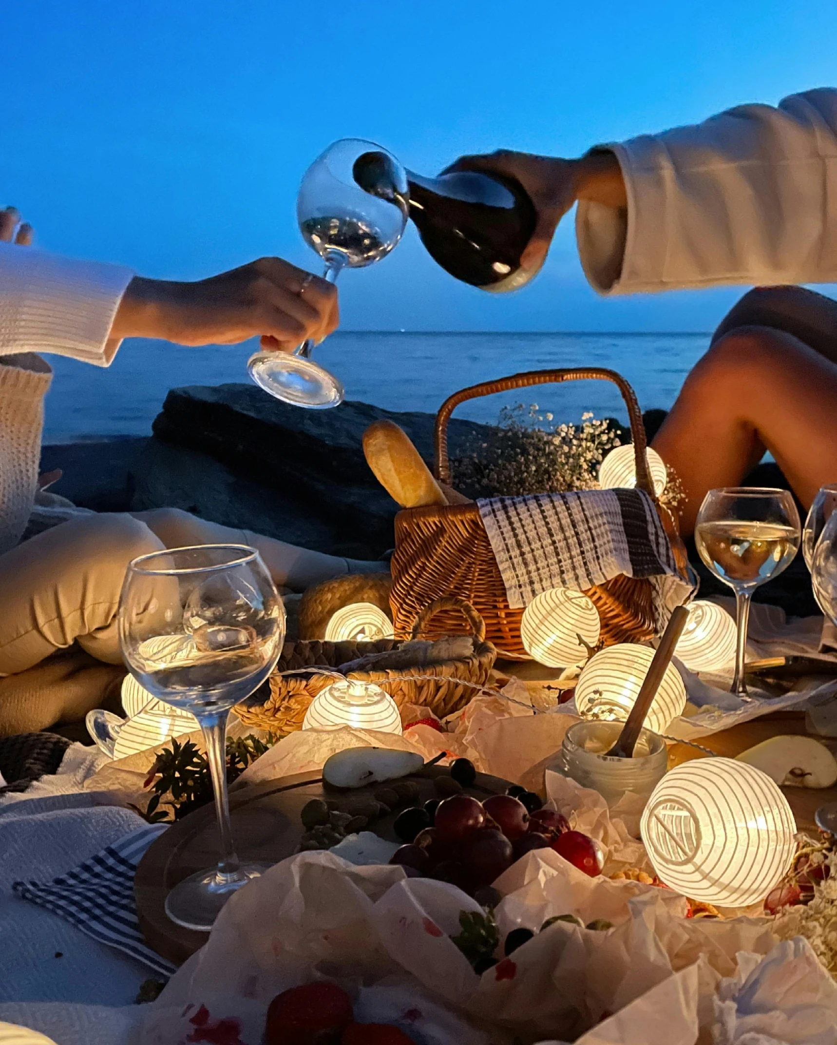 a number of people sitting at a table with wine glasses