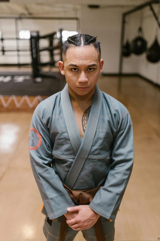 an image of a man in kimono standing on the floor