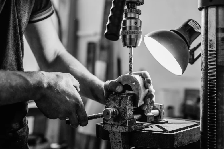 a black and white po of a person working on soing