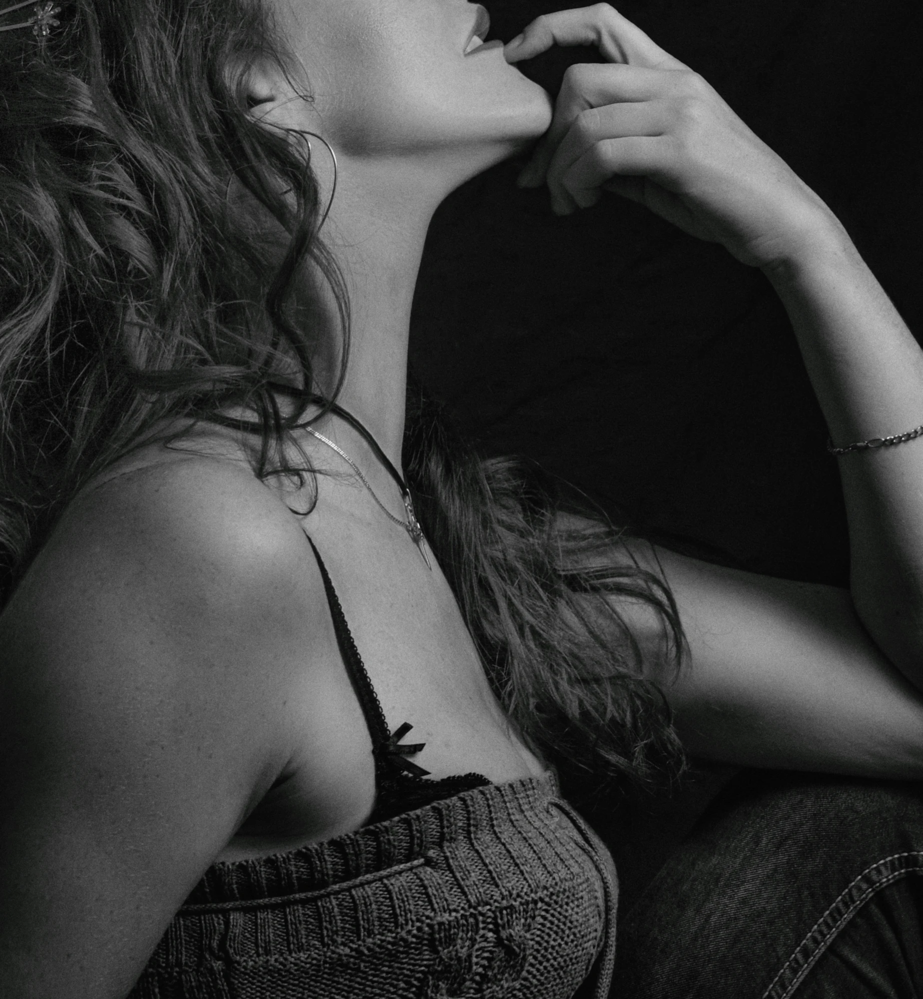 a woman is sitting down eating some food