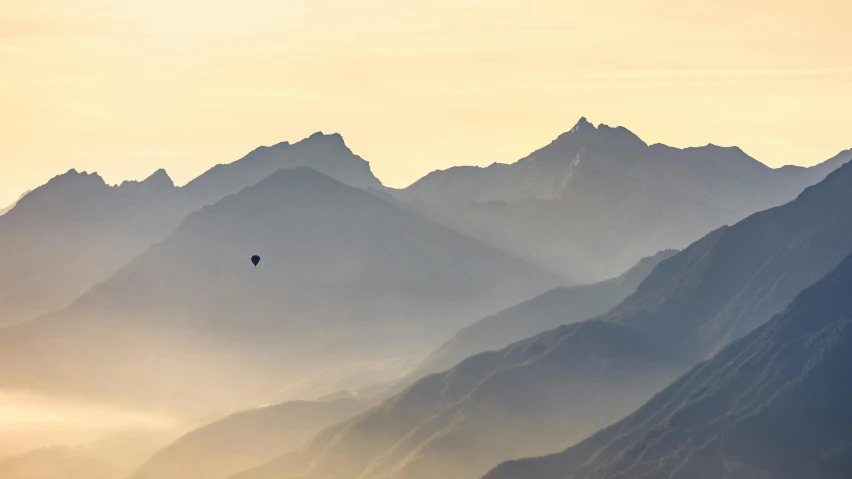 an image of the hills in a misty mountain range