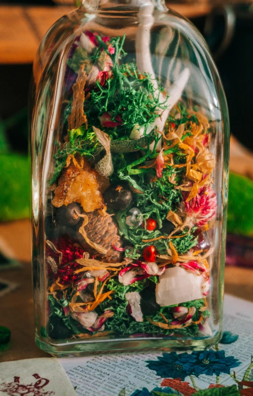 a bottle full of edible food on a table