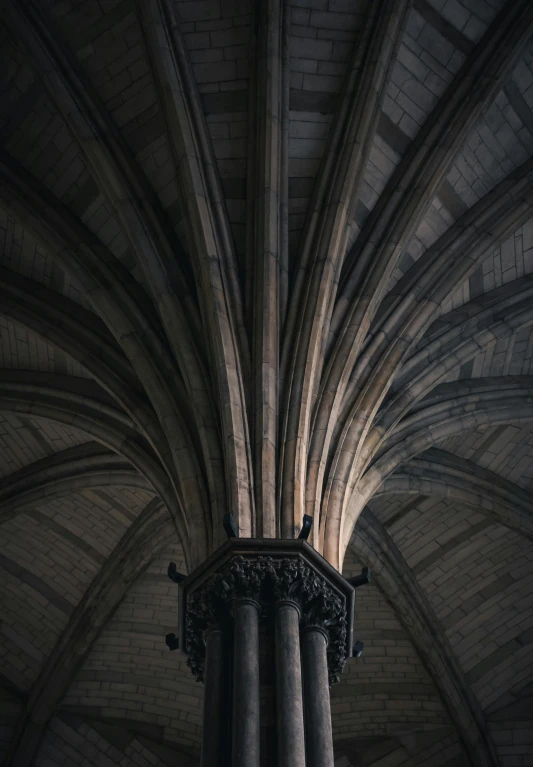 columns inside of a building with stone walls