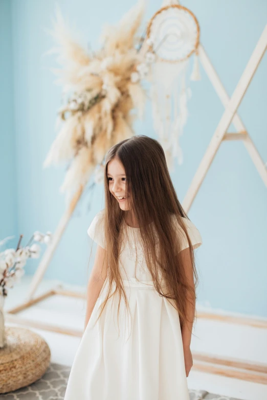  in white dress looking into the distance