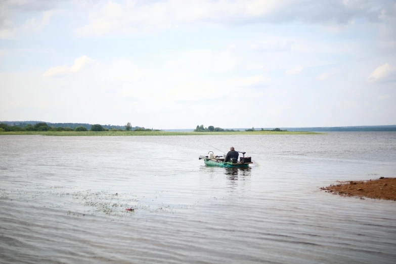 there are two people on a small boat in the water