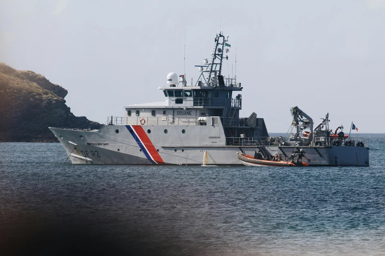 a large military vessel floating in the ocean