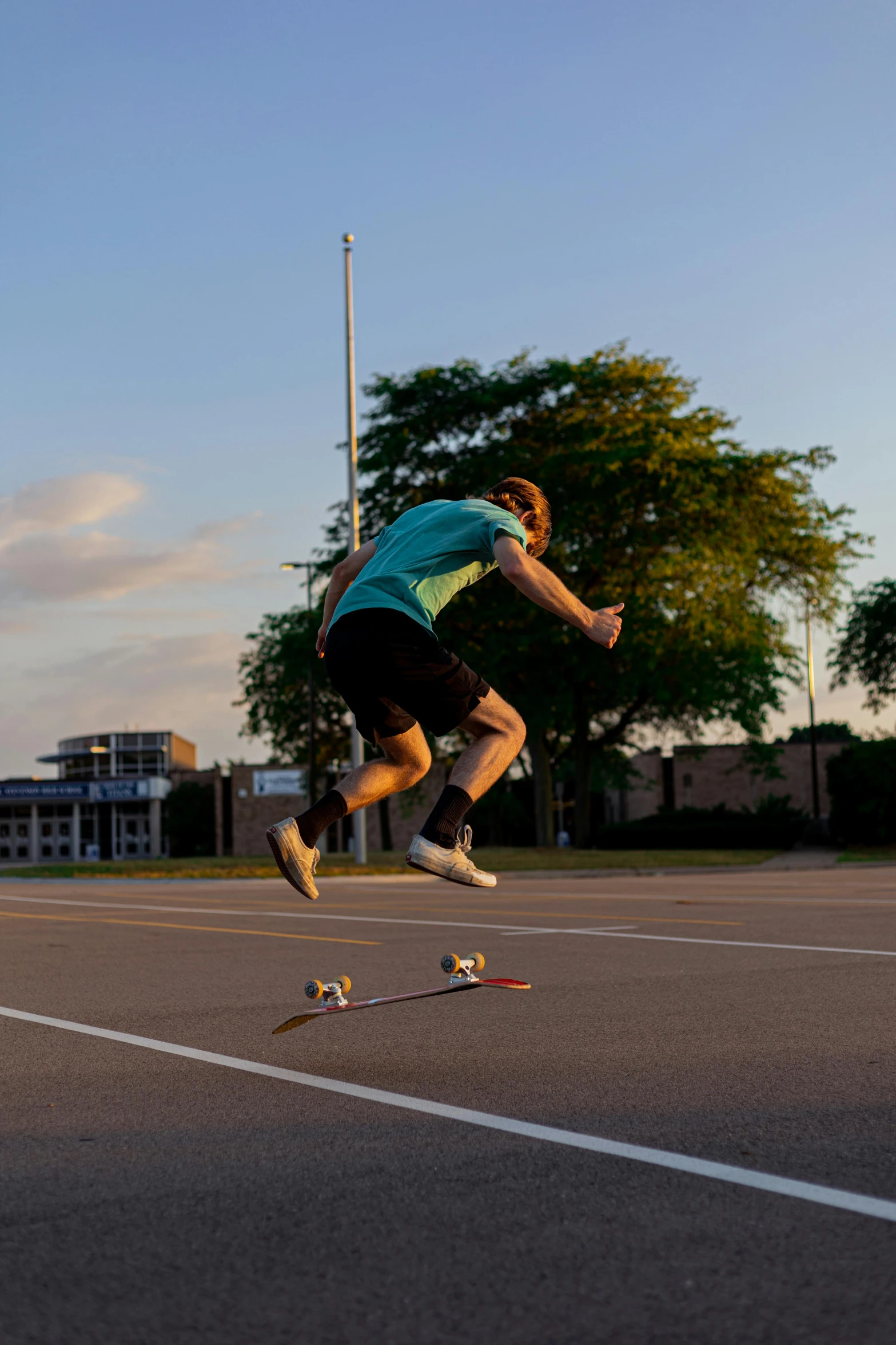 a skateboarder is jumping in the air over a set of ramps