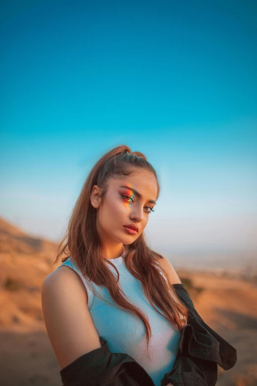 a girl with red eyeliners posing for a po